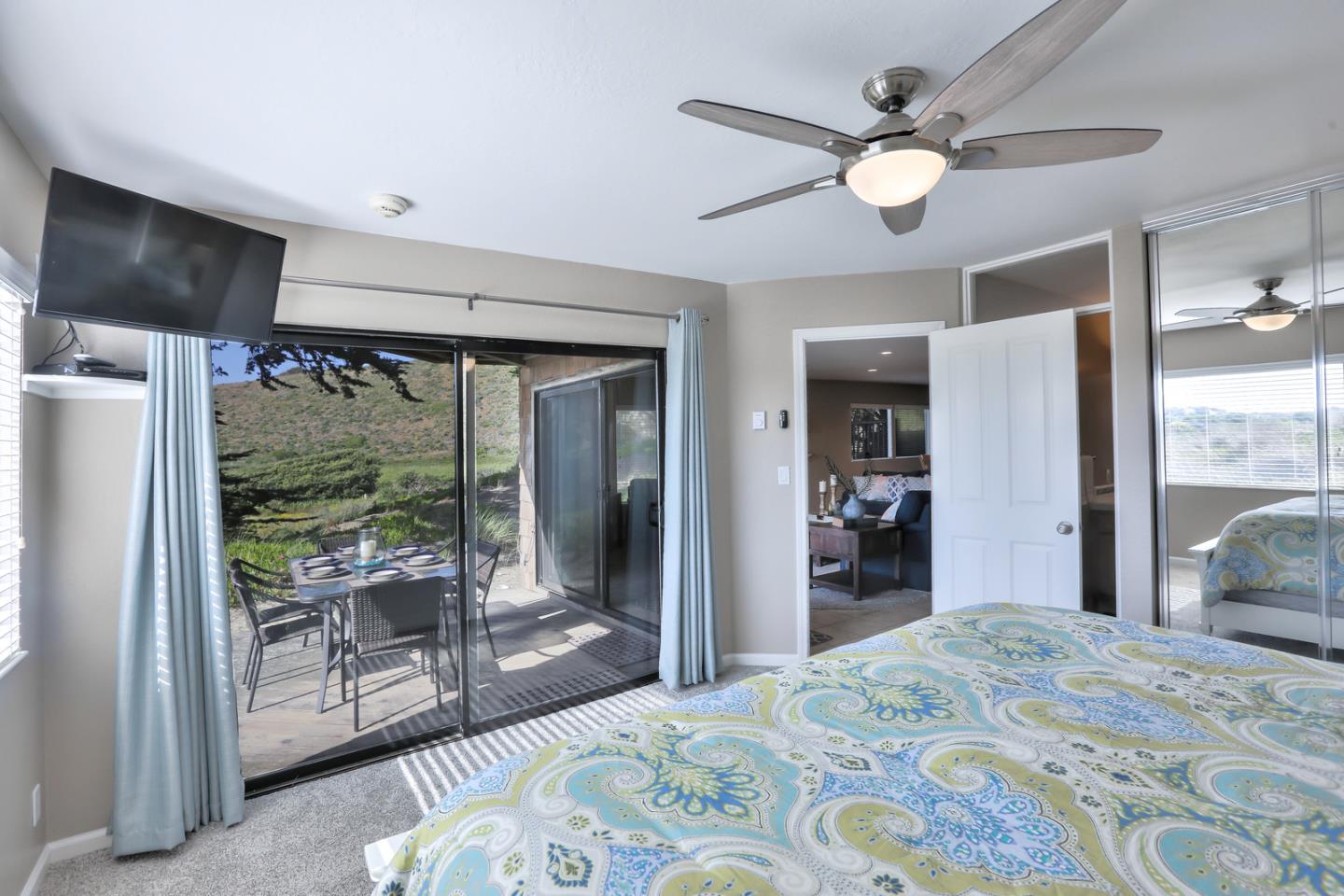 101 Shell Road, Unit 285 Watsonville, CA 95076 - Photo 9 of 27 a bedroom with a bed and glass walk in closet