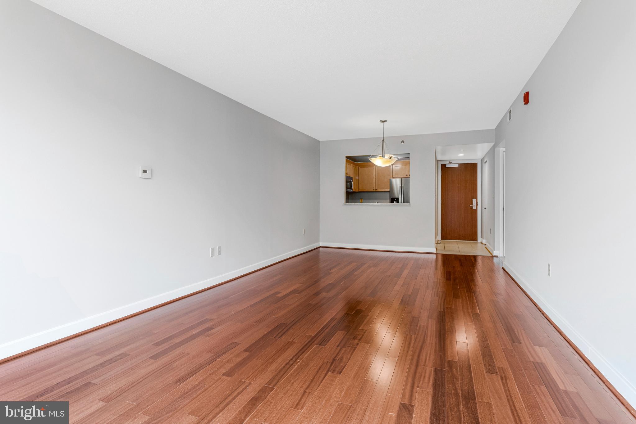 1150 K Street Northwest, Unit 1307 Washington, DC 20005 - Photo 11 of 29 a view of empty room with wooden floor