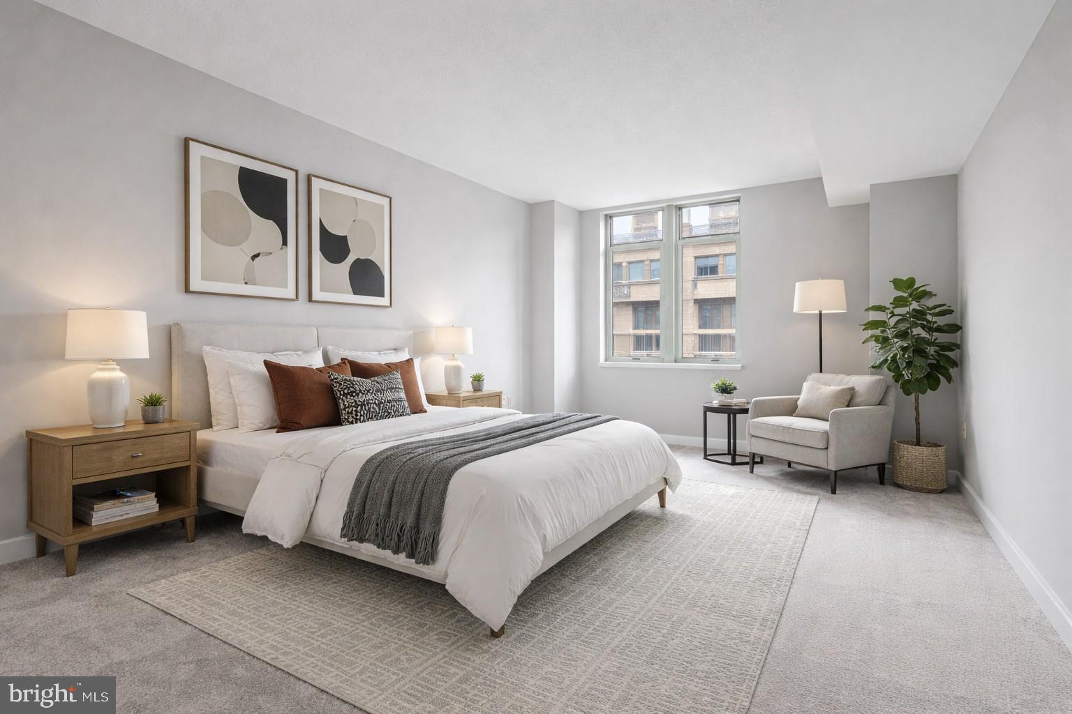 1150 K Street Northwest, Unit 1307 Washington, DC 20005 - Photo 4 of 29 a spacious bedroom with a bed and a couch