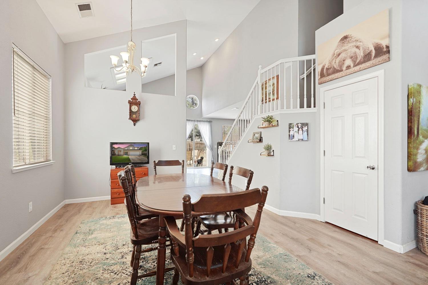 924 Dancer Way Turlock, CA 95382 - Photo 15 of 42 a view of a dining room with furniture and wooden floor