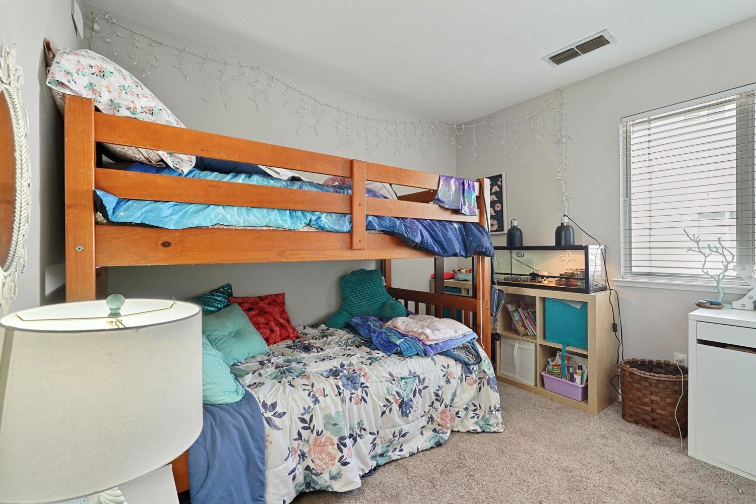 924 Dancer Way Turlock, CA 95382 - Photo 19 of 42 a bedroom with a bed and a kitchen