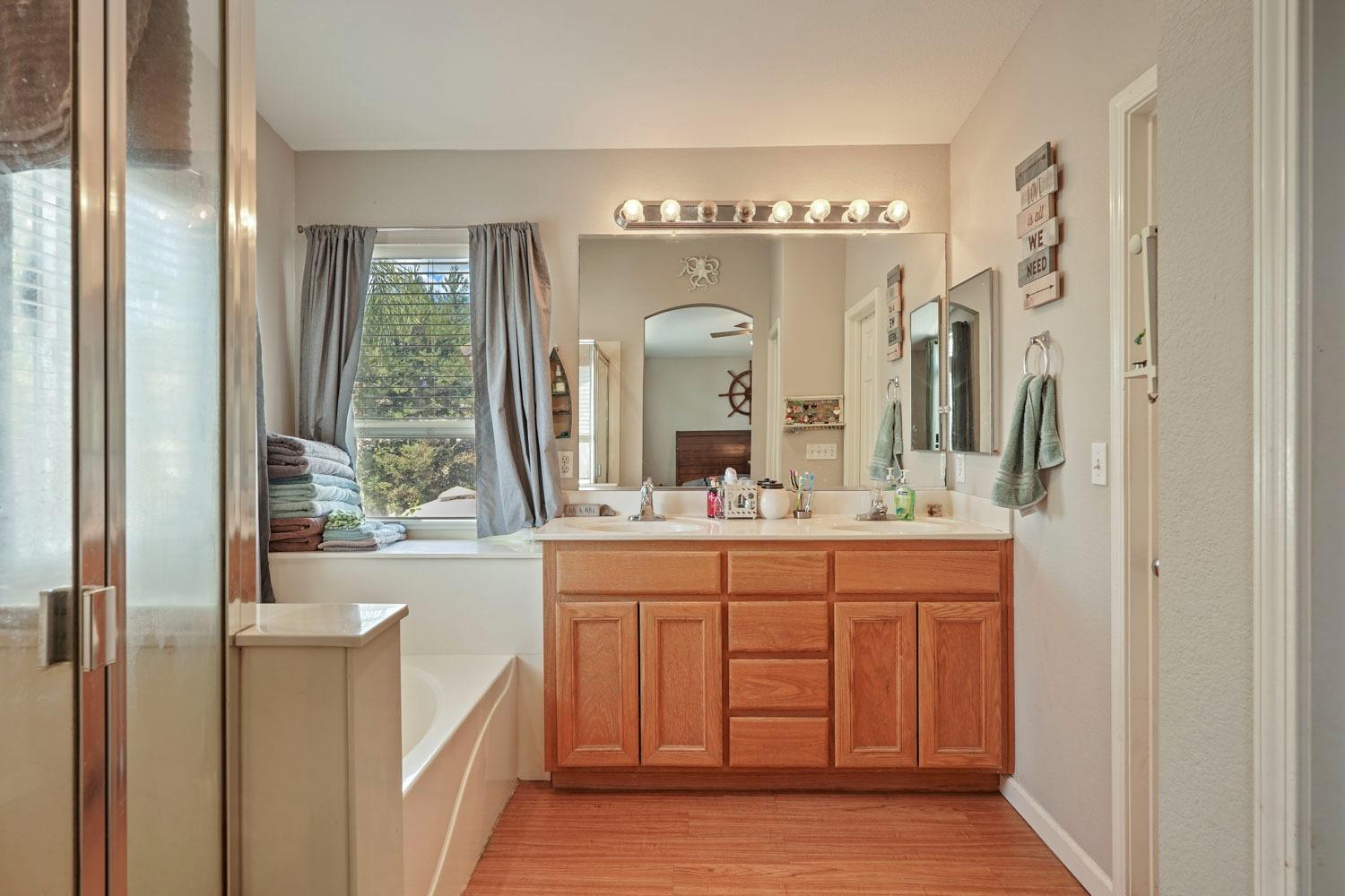 924 Dancer Way Turlock, CA 95382 - Photo 29 of 42 a bathroom with a double vanity sink and a mirror