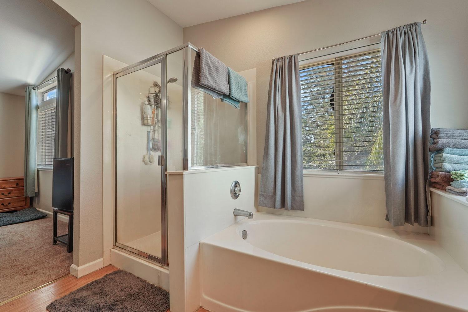 924 Dancer Way Turlock, CA 95382 - Photo 30 of 42 a bathroom with a bathtub and a shower