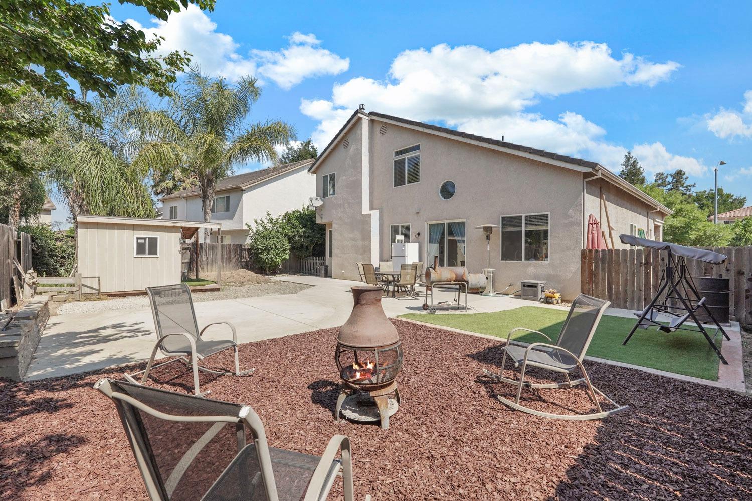 924 Dancer Way Turlock, CA 95382 - Photo 32 of 42 a view of a backyard with sitting area