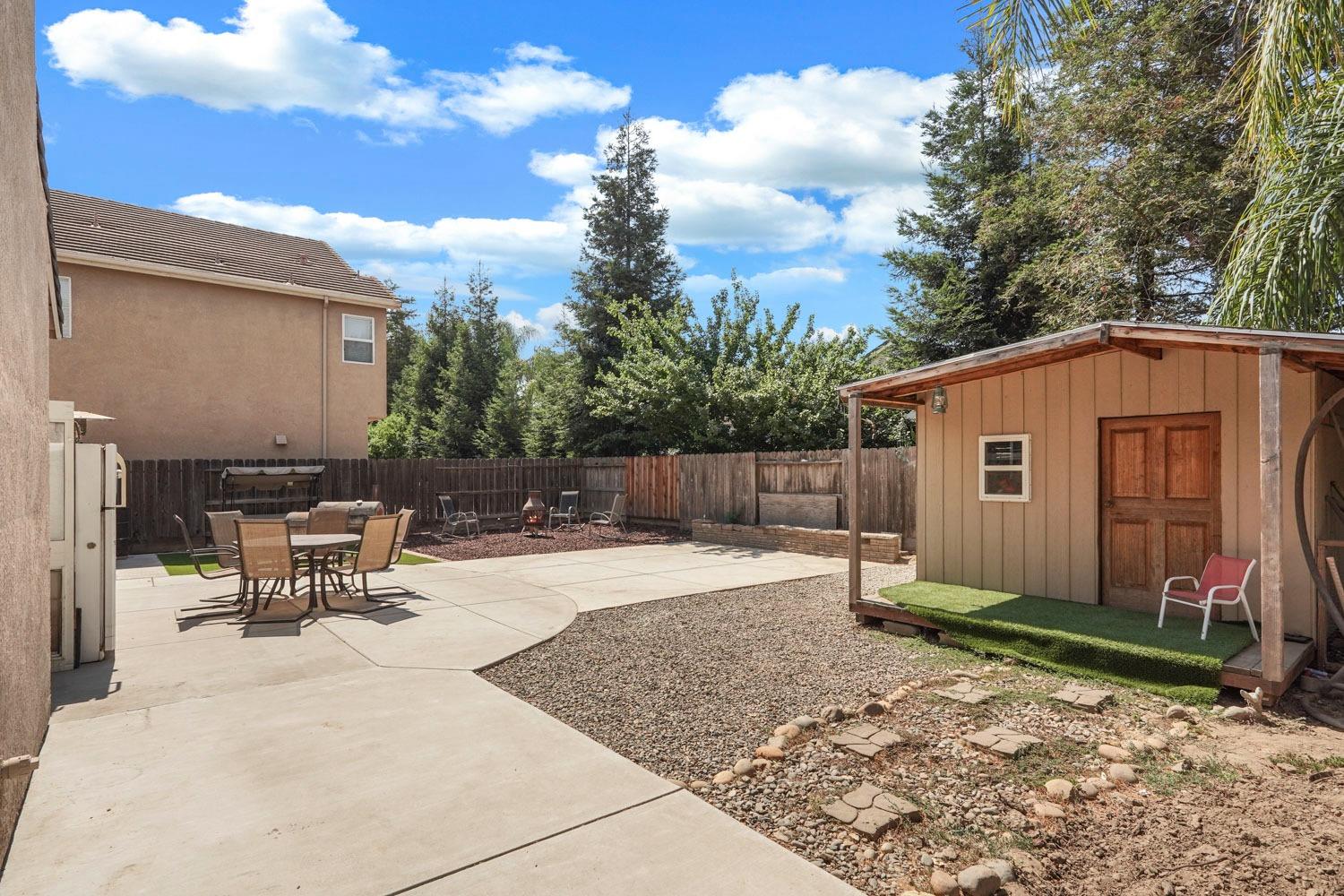 924 Dancer Way Turlock, CA 95382 - Photo 34 of 42 a backyard of a house with yard and outdoor seating