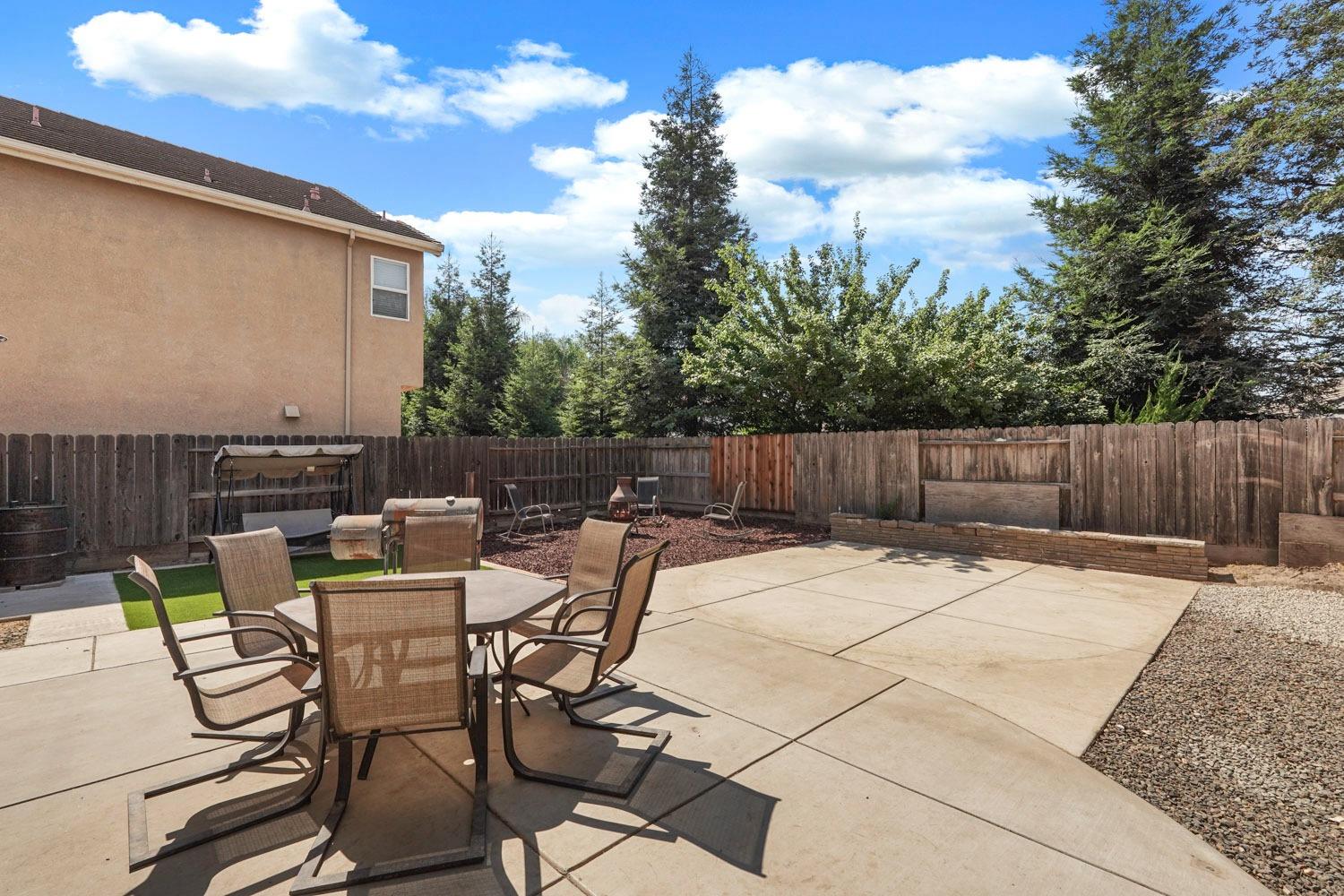 924 Dancer Way Turlock, CA 95382 - Photo 36 of 42 a view of backyard with seating space and wooden fence