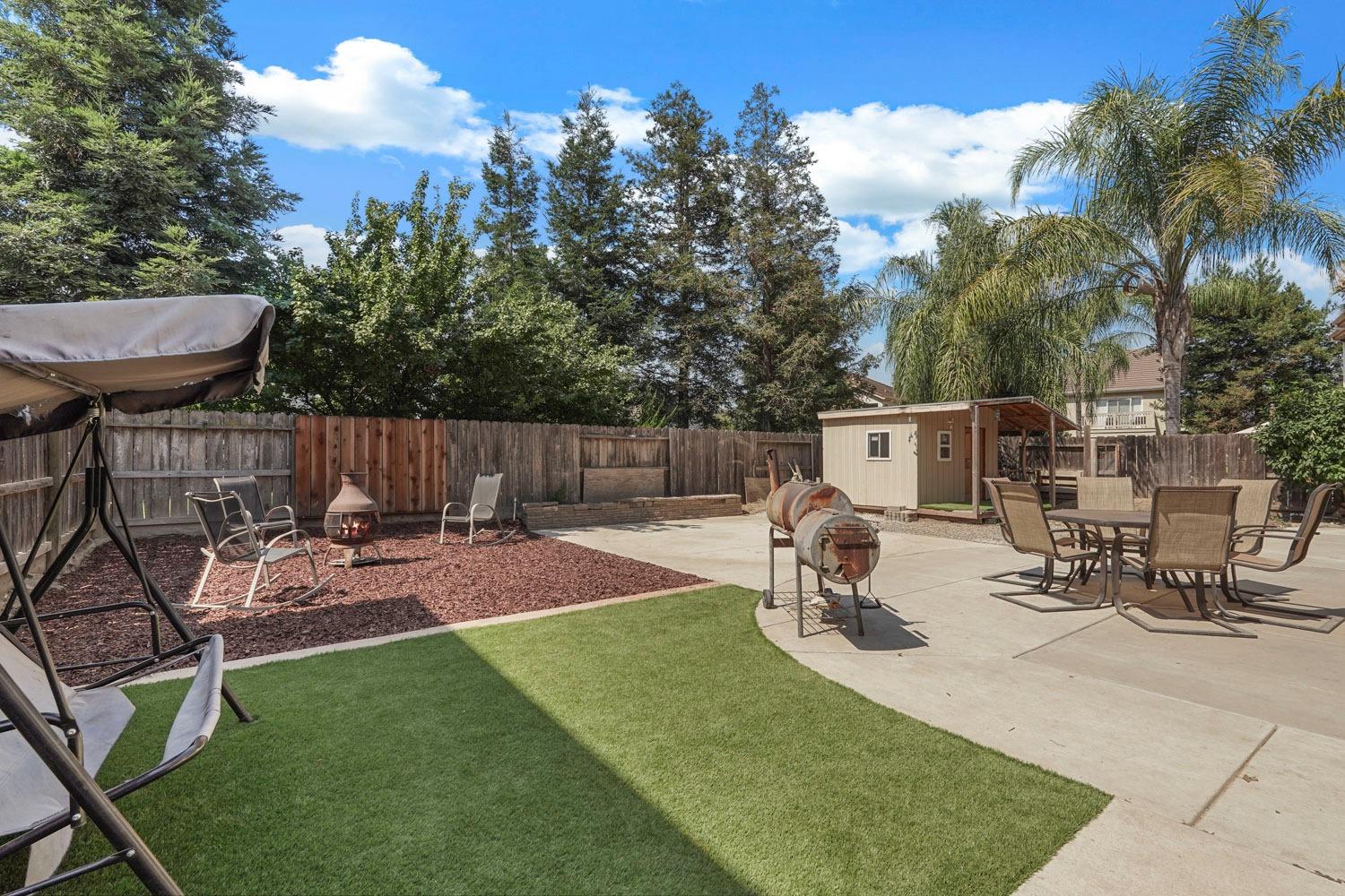 924 Dancer Way Turlock, CA 95382 - Photo 39 of 42 a view of a backyard with sitting area