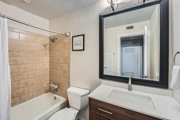 a bathroom with a shower and a toilet