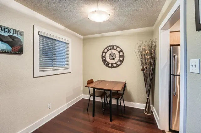 a view of a room with a table and a chair