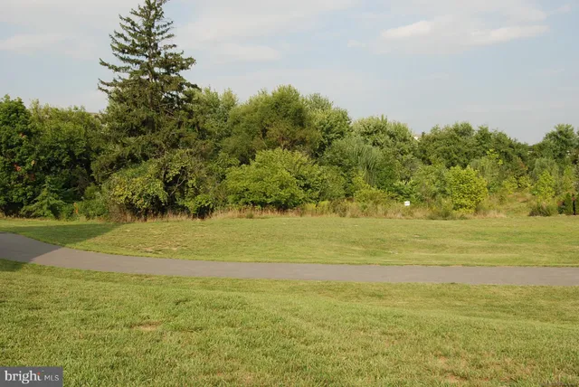 a view of a cars park in front of a building