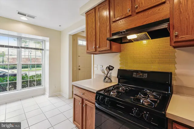 a kitchen with a stove and a cabinet