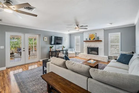 a living room with furniture and a fireplace