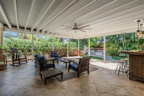 a view of a patio with a table and chairs