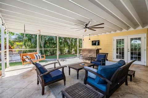 a outdoor space with patio the couches and a dining table with garden view