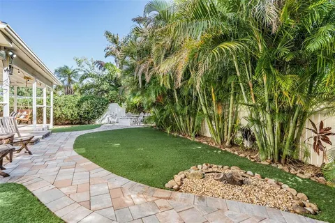 a view of a backyard with sitting area