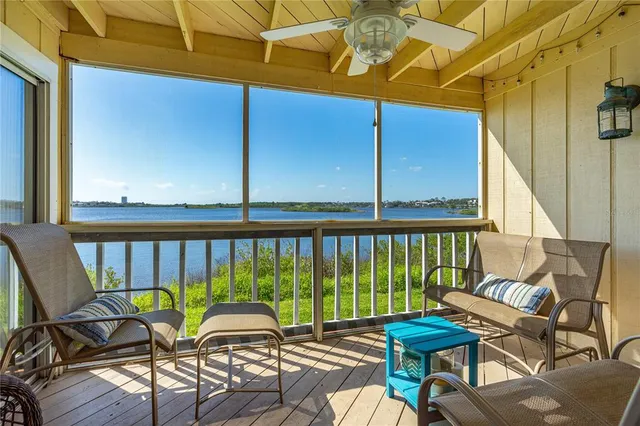 a view of a chairs and table in patio