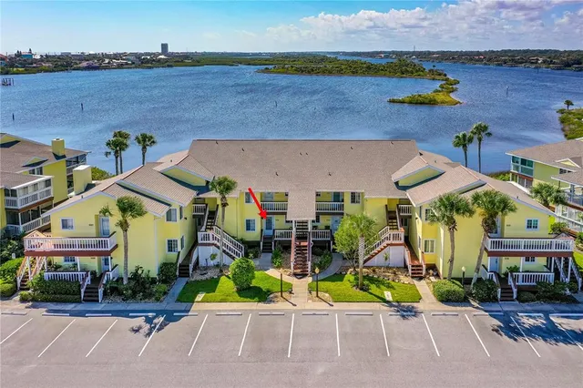 an aerial view of a house with outdoor space