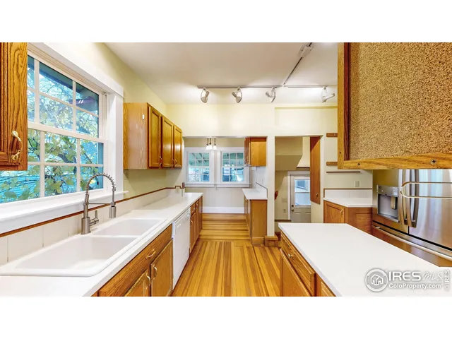 a bathroom with a sink and a large window