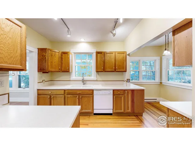 a kitchen with stainless steel appliances granite countertop a sink and cabinets