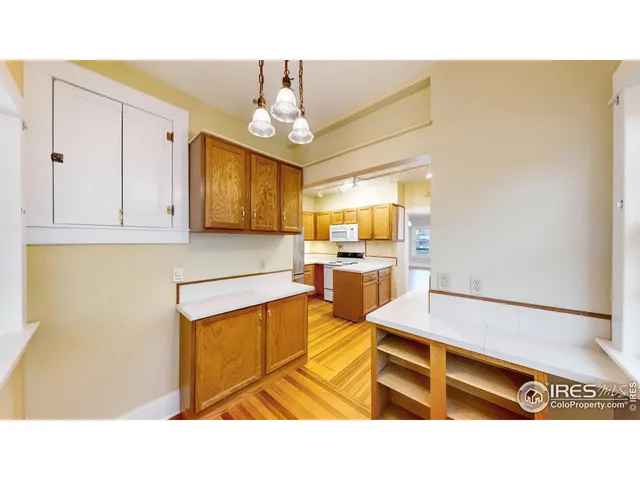 a living room with stainless steel appliances kitchen island granite countertop furniture and a view of kitchen