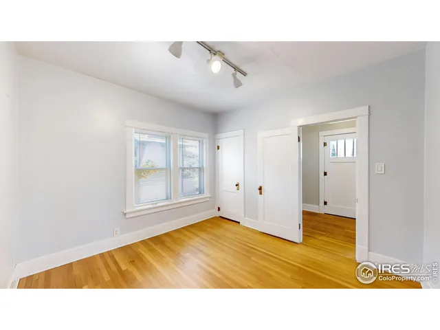 a bathroom with a tub a sink and a large mirror