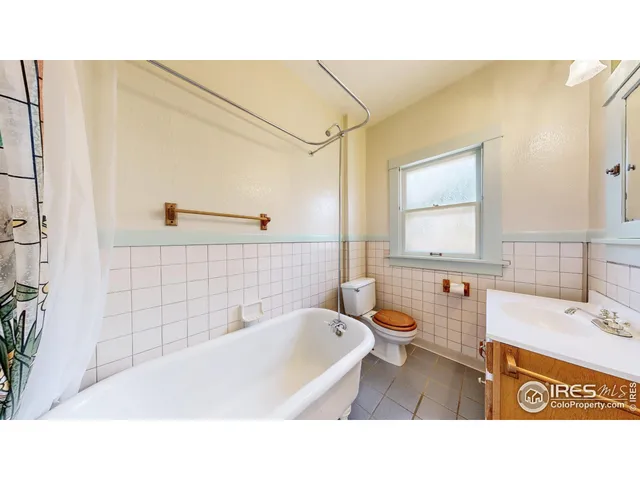 a bathroom with a sink a mirror and a bathtub