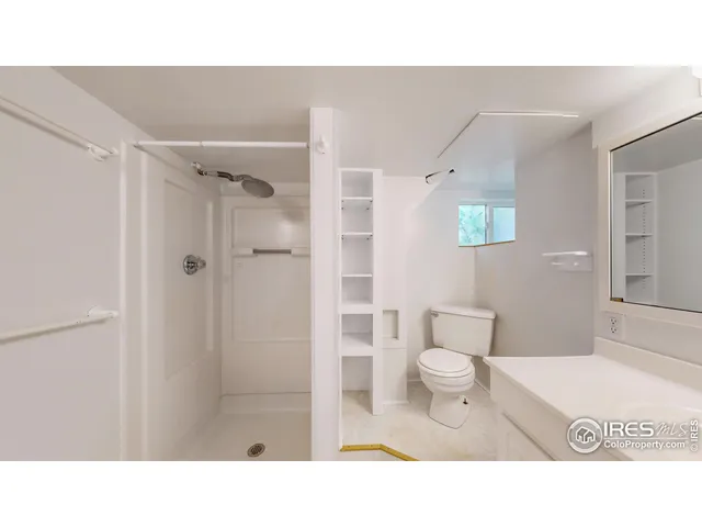 a bathroom with a sink toilet a mirror and bathtub