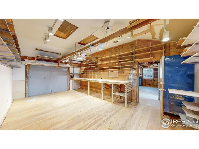 a bathroom with a sink and a view of living room