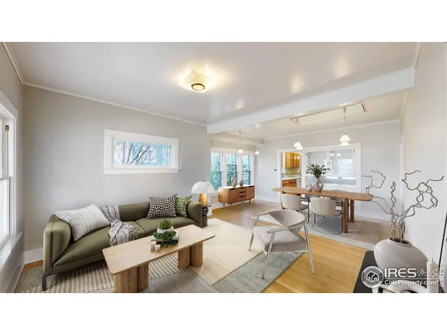 a living room with furniture and a lamp