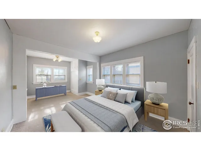 a bedroom with a bed and window