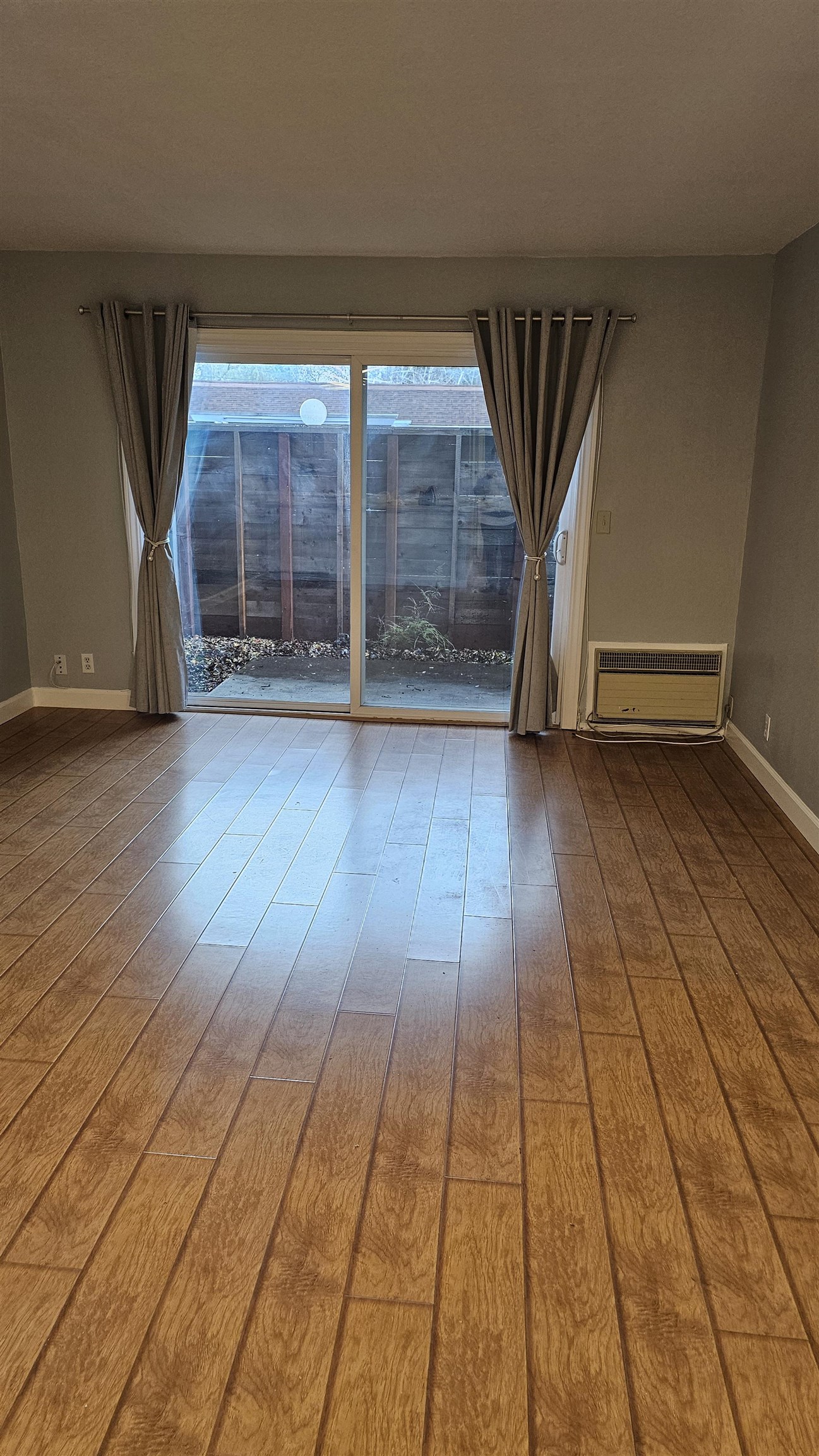 4081 Clayton Road, Unit 122 Concord, CA 94521 - Photo 19 of 29 an empty room with wooden floor and windows