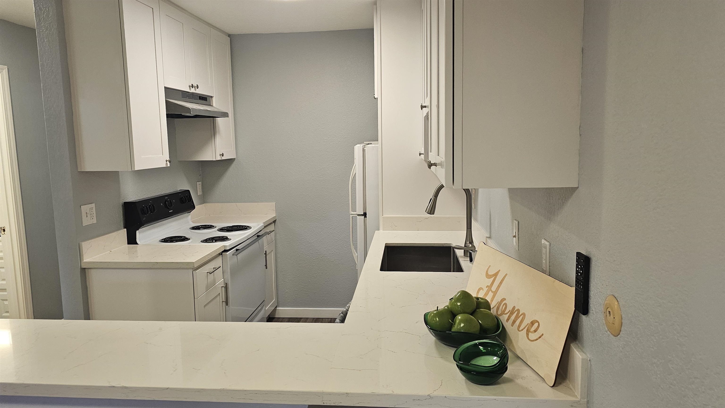 4081 Clayton Road, Unit 122 Concord, CA 94521 - Photo 24 of 29 a kitchen with stainless steel appliances a stove a microwave and a refrigerator