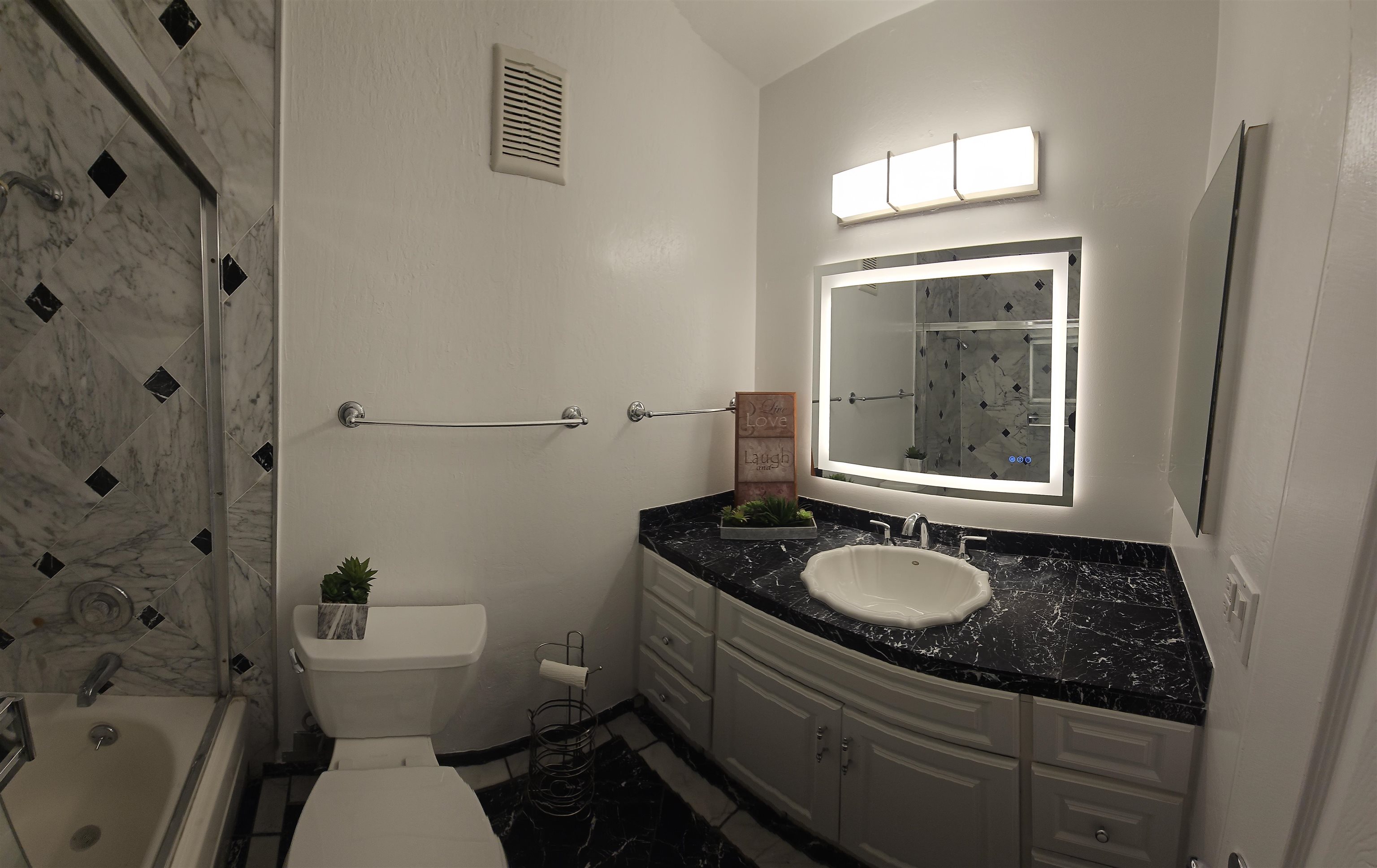 4081 Clayton Road, Unit 122 Concord, CA 94521 - Photo 27 of 29 a bathroom with a granite countertop toilet sink and mirror