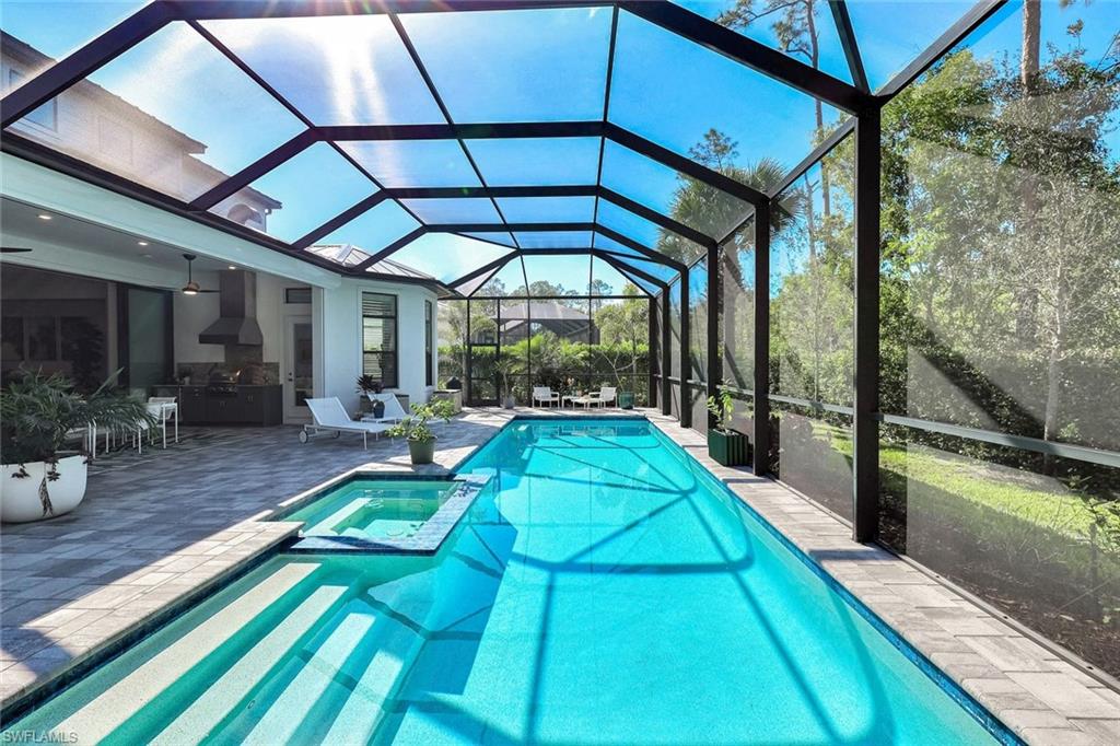 16249 Verilyn Circle Naples, FL 34110 - Photo 2 of 48 a view of swimming pool with a patio