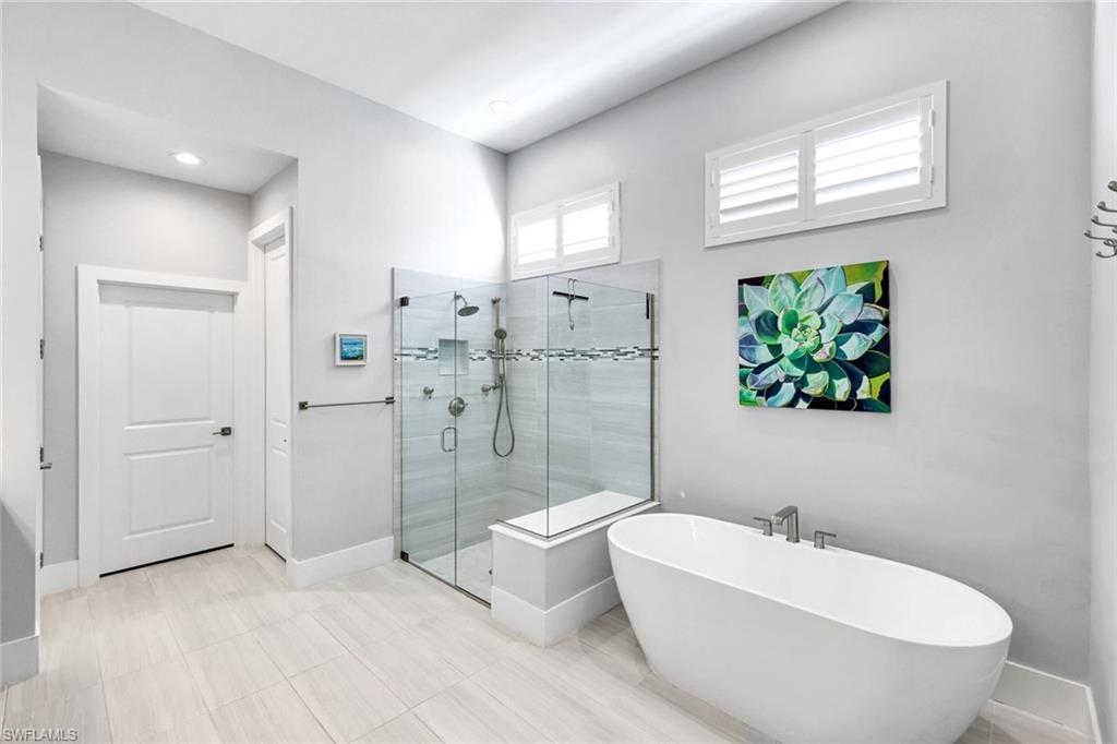 16249 Verilyn Circle Naples, FL 34110 - Photo 21 of 48 a bathroom with a bathtub sink and toilet