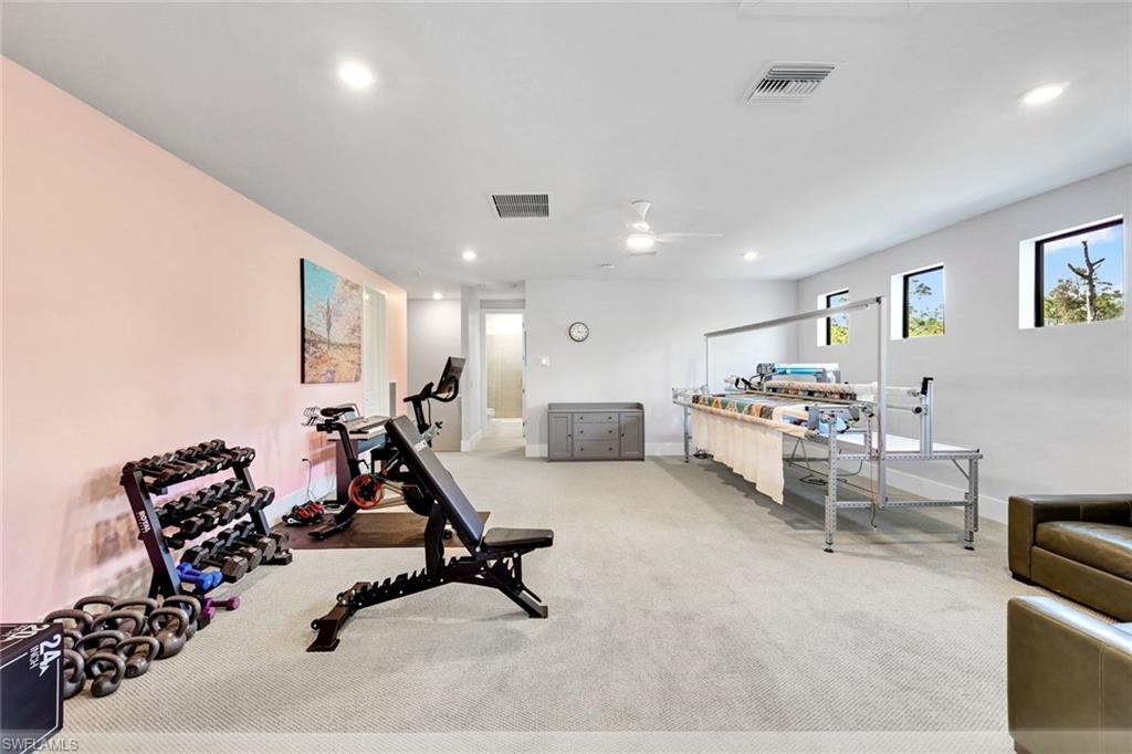 16249 Verilyn Circle Naples, FL 34110 - Photo 27 of 48 a view of a room with gym equipment