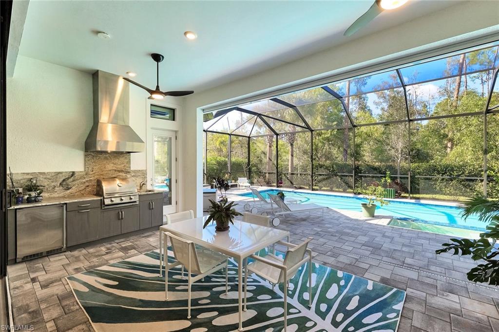 16249 Verilyn Circle Naples, FL 34110 - Photo 37 of 48 a dining room with furniture water view and wooden floor