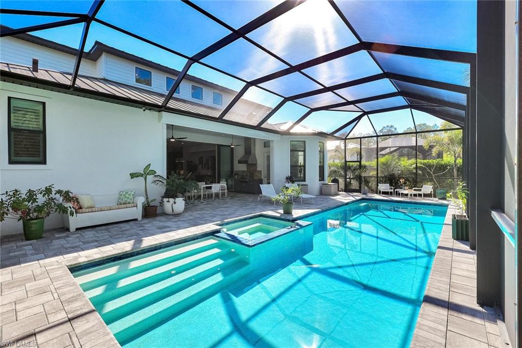 16249 Verilyn Circle Naples, FL 34110 - Photo 40 of 48 a view of swimming pool with a patio