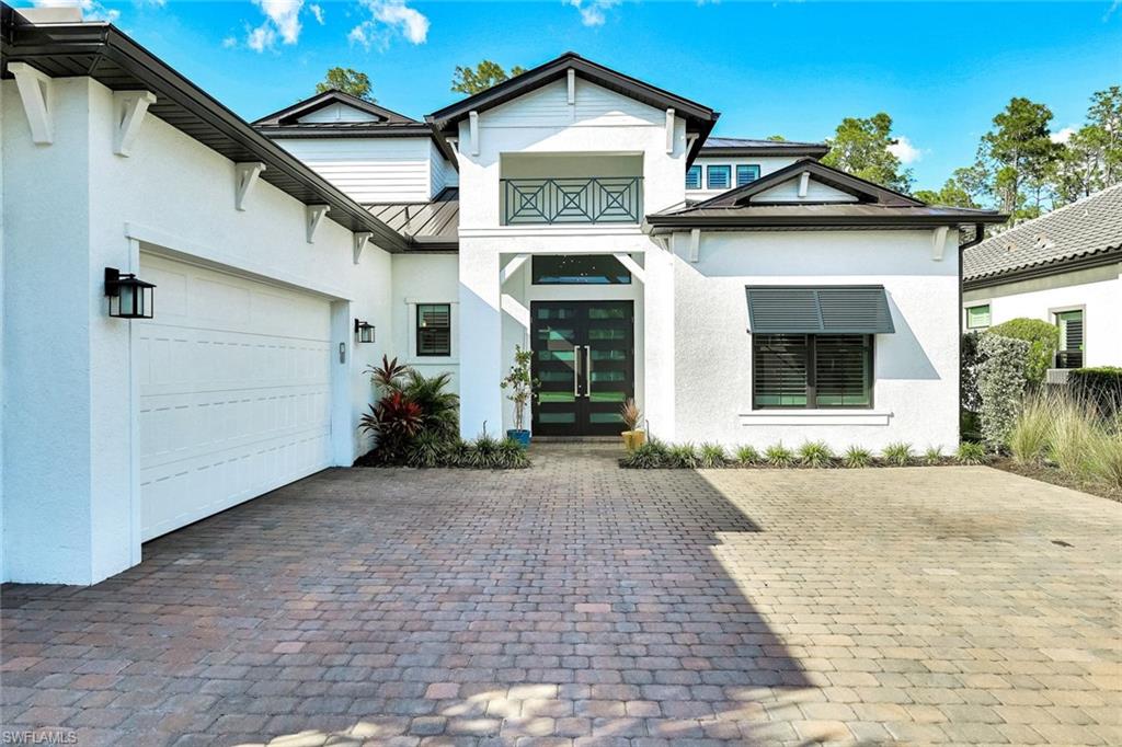 16249 Verilyn Circle Naples, FL 34110 - Photo 4 of 48 a view of a house with a snow in front of it