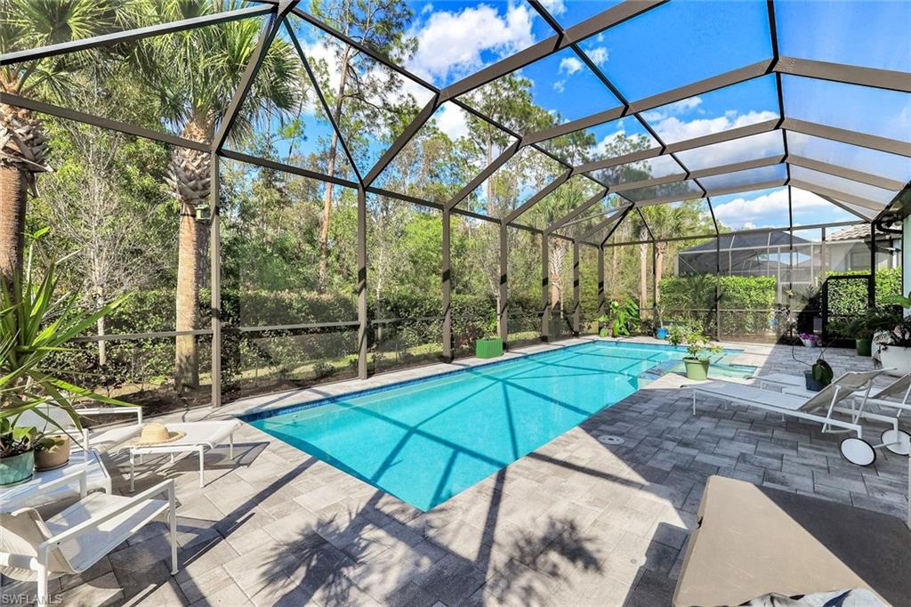 16249 Verilyn Circle Naples, FL 34110 - Photo 42 of 48 a view of a backyard with sitting area