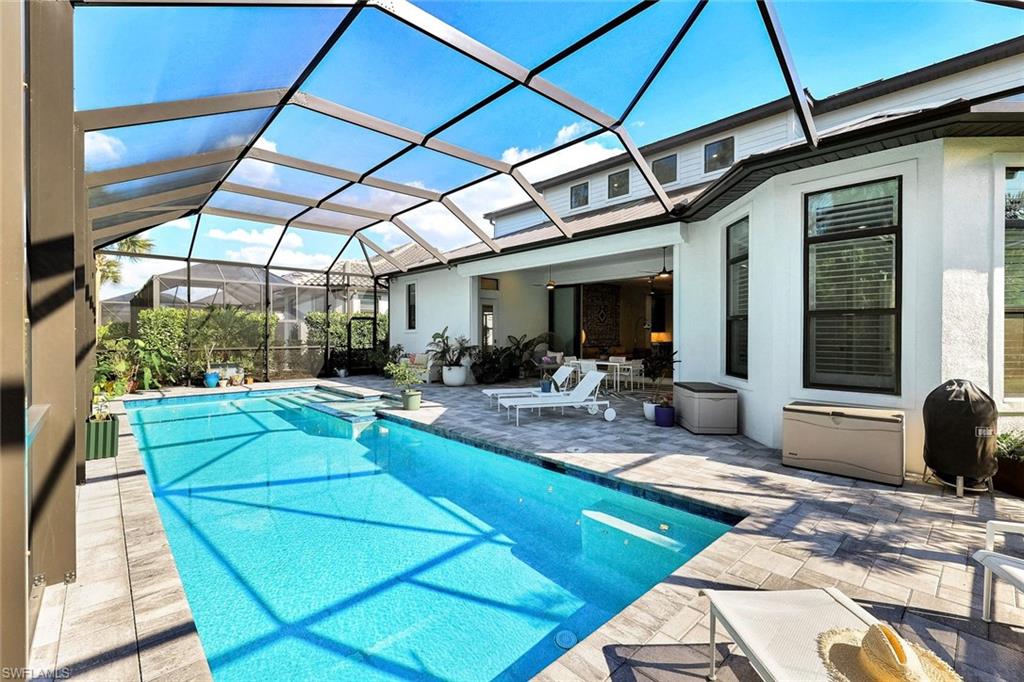 16249 Verilyn Circle Naples, FL 34110 - Photo 43 of 48 a view of a backyard with swimming pool and furniture