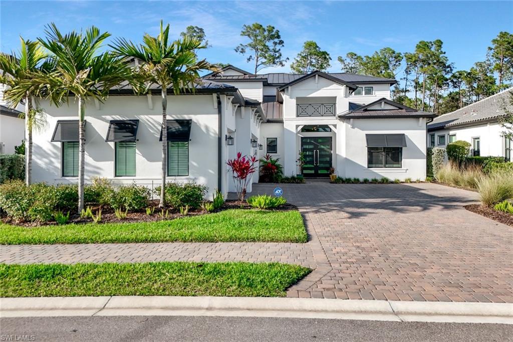 16249 Verilyn Circle Naples, FL 34110 - Photo 44 of 48 a front view of house with yard and green space