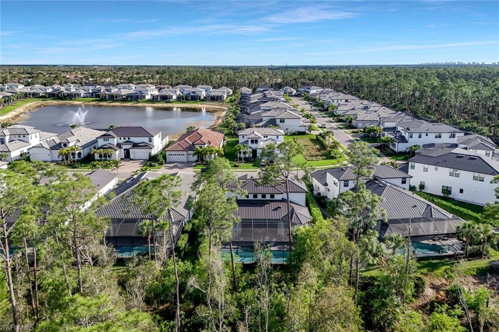 16249 Verilyn Circle Naples, FL 34110 - Photo 45 of 48 an aerial view of house with yard and ocean view