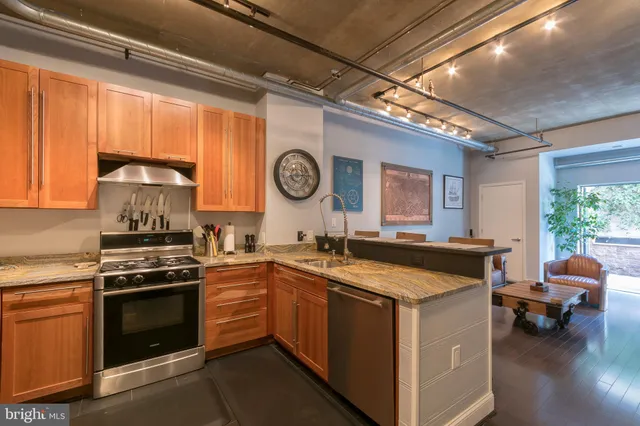a kitchen with a stove and a refrigerator