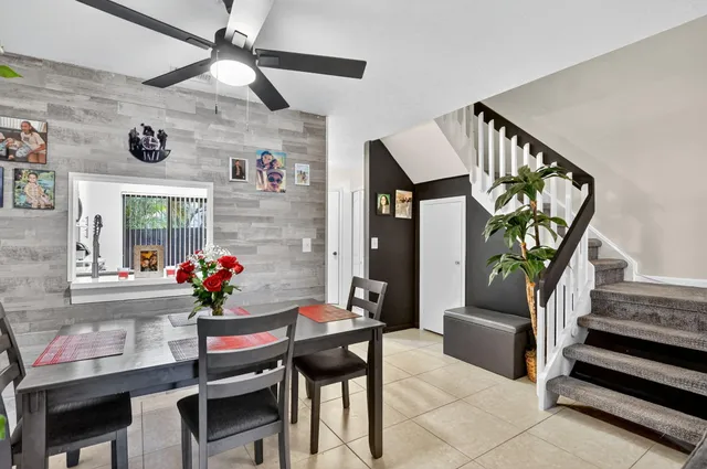 a kitchen with stainless steel appliances granite countertop a refrigerator and a stove