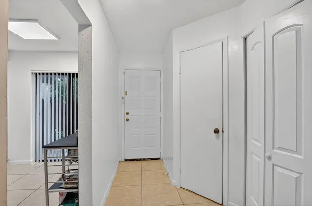 a bathroom with a sink vanity mirror and toilet
