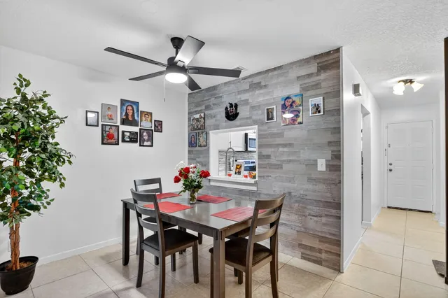 a bedroom with a bed a large window and a flat screen television