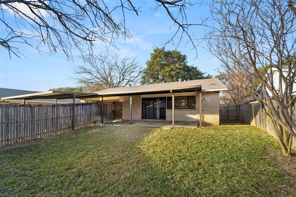 928 Overdowns Drive Plano, TX 75023 - Photo 11 of 11 a front view of house with yard and trees in the background