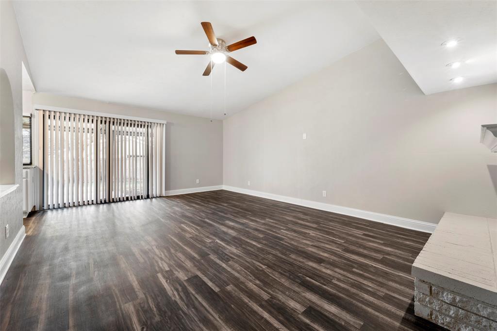 928 Overdowns Drive Plano, TX 75023 - Photo 2 of 11 an empty room with wooden floor and windows