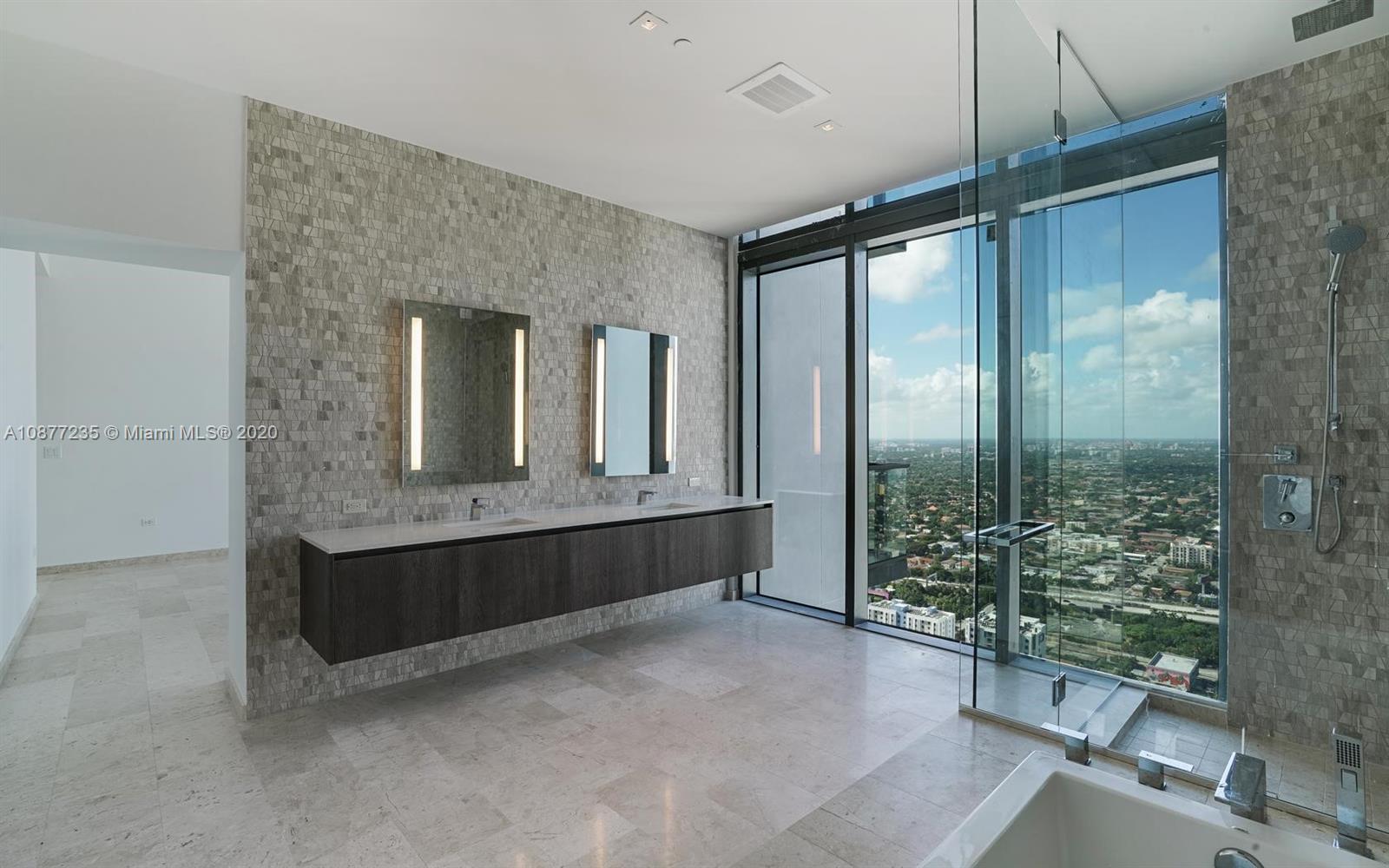 88 Southwest 7th Street, Unit 4001 Miami, FL 33130 - Photo 19 of 21 a spacious bathroom with a shower and a sink